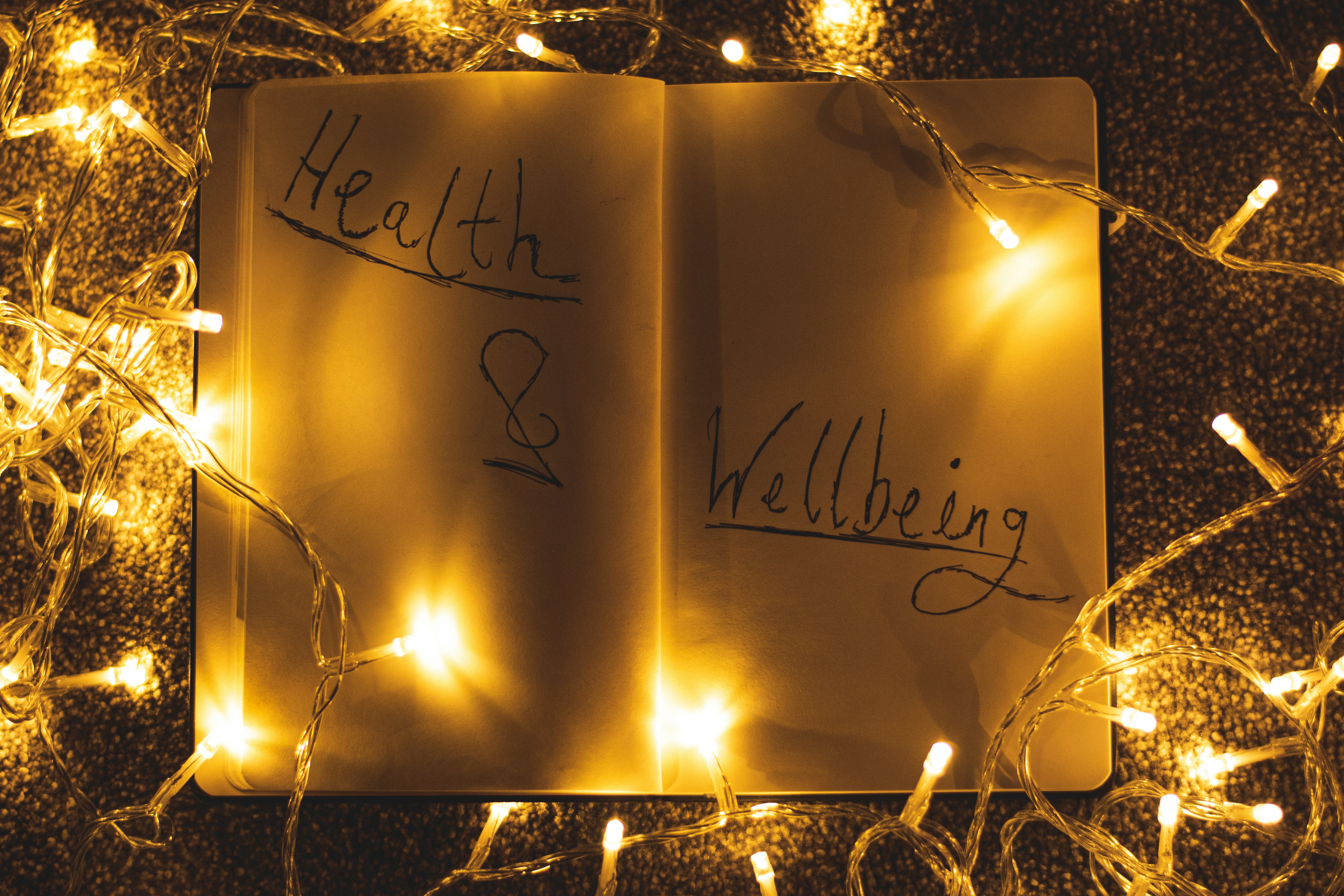 a book with writing on it with lights around it