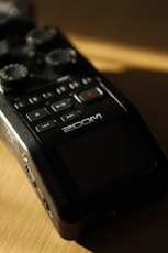 a close up of a remote control on a table