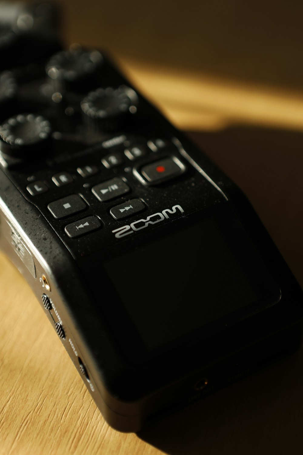 a close up of a remote control on a table