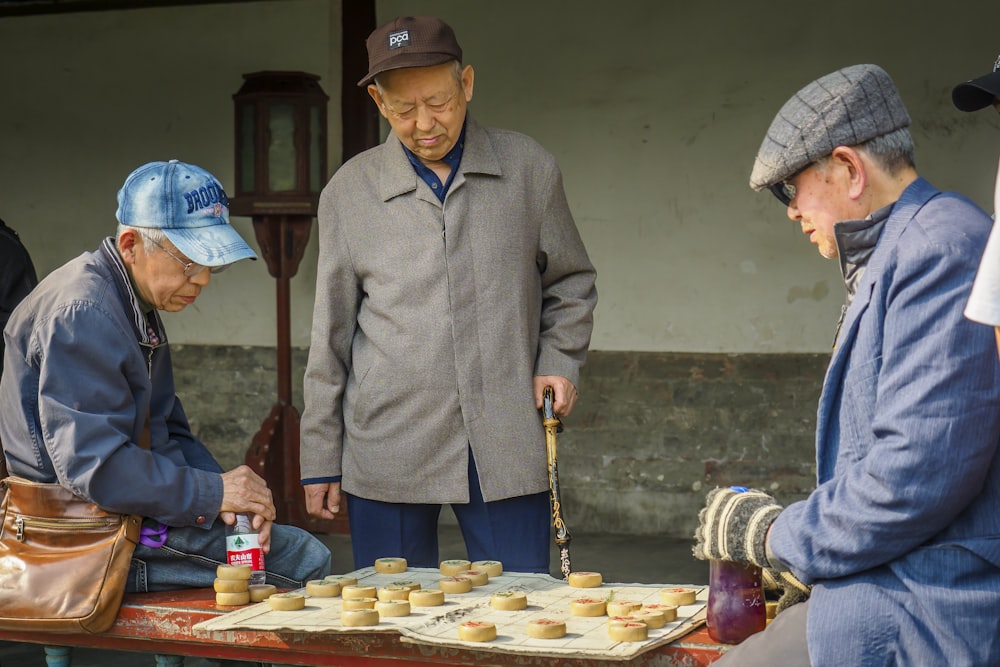 a group of men playing a game of checkers