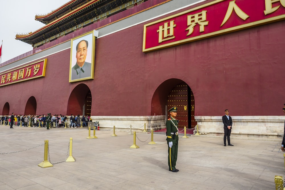 a group of people standing in front of a building