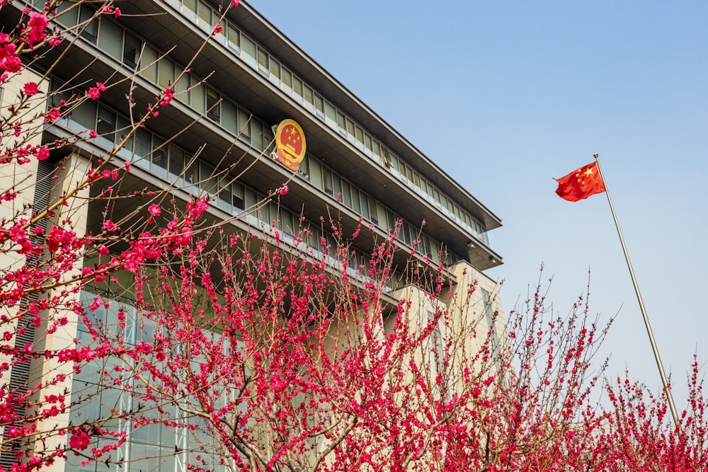 a building with a chinese flag flying in front of it