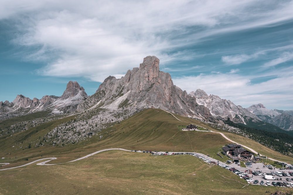 a scenic view of a mountain with a winding road