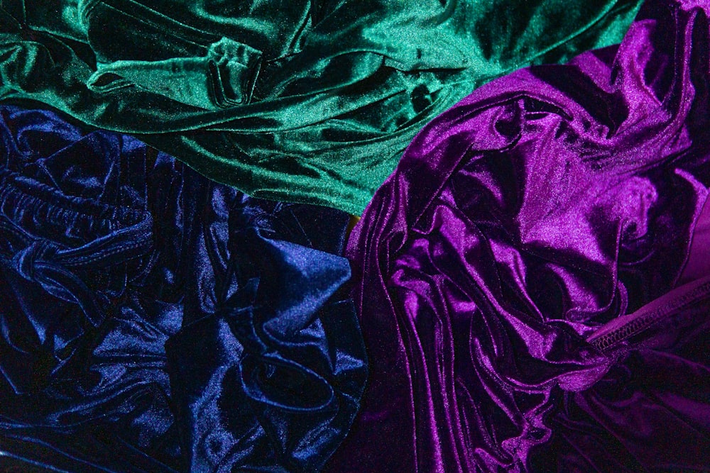 a close up of a purple and green cloth