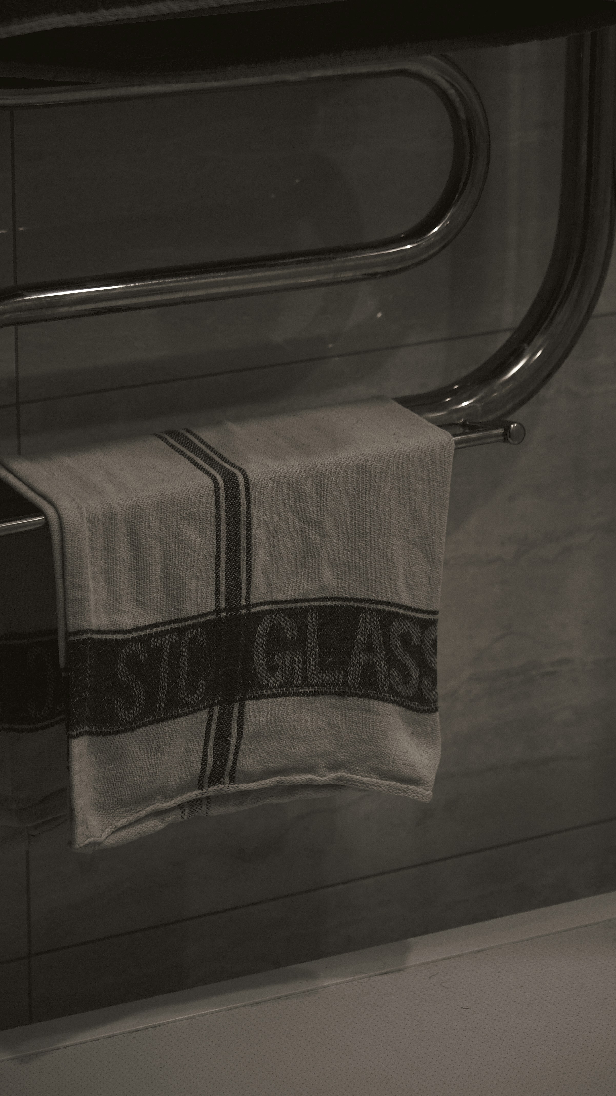 a towel hanging on a towel rack in a bathroom