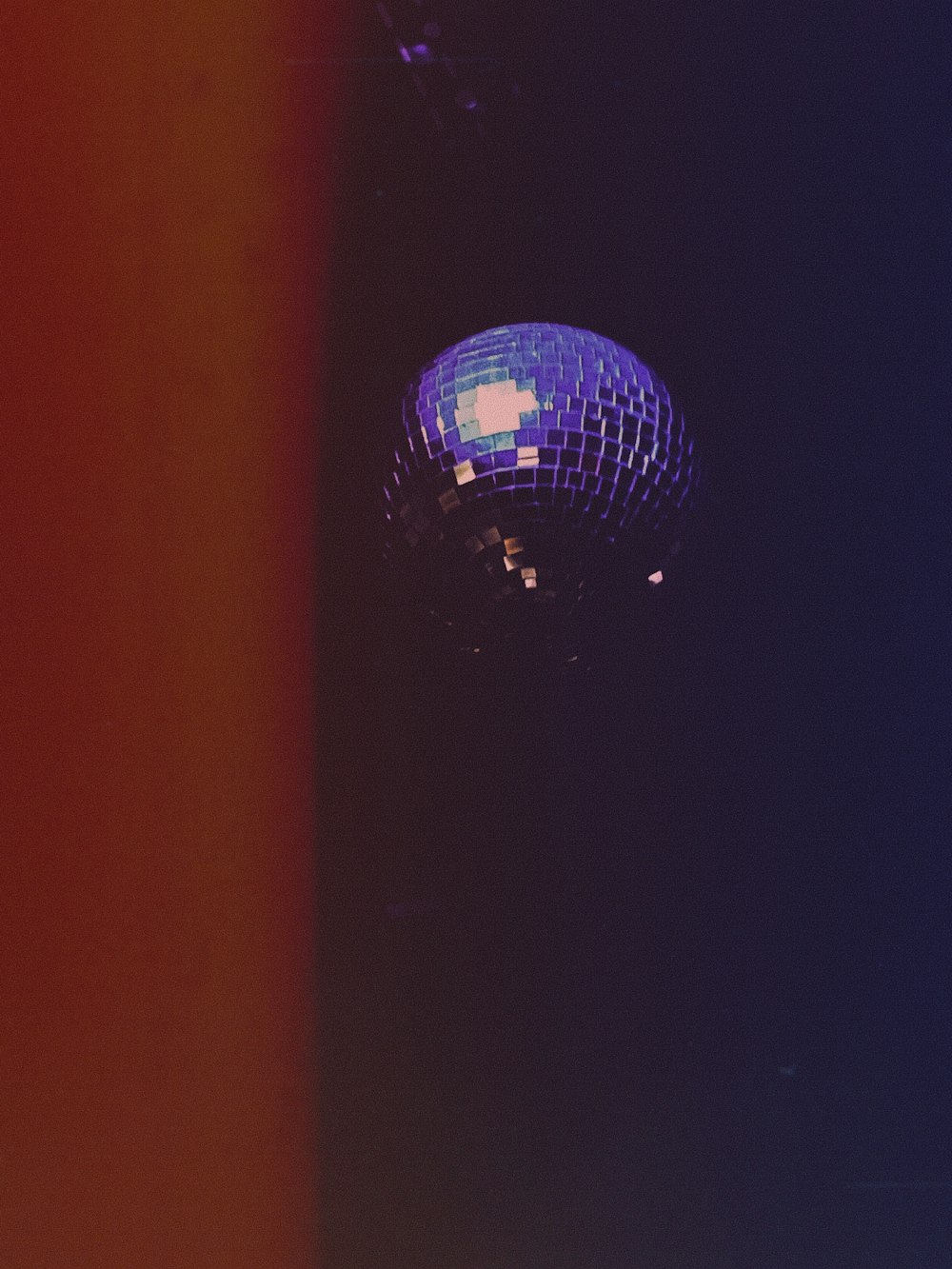 a disco ball sitting in the middle of a room