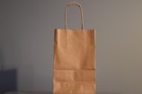 a brown paper bag sitting on top of a table