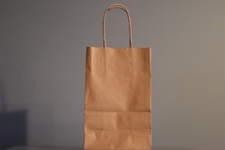 a brown paper bag sitting on top of a table