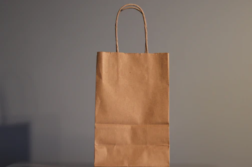 a brown paper bag sitting on top of a table