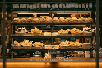 a bakery filled with lots of different types of bread