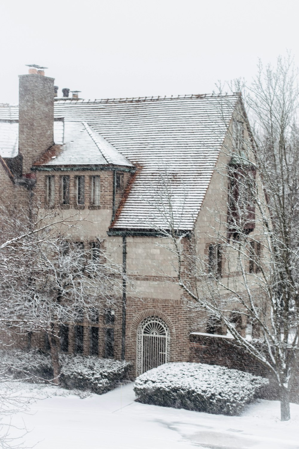 a large house with a clock on the front of it