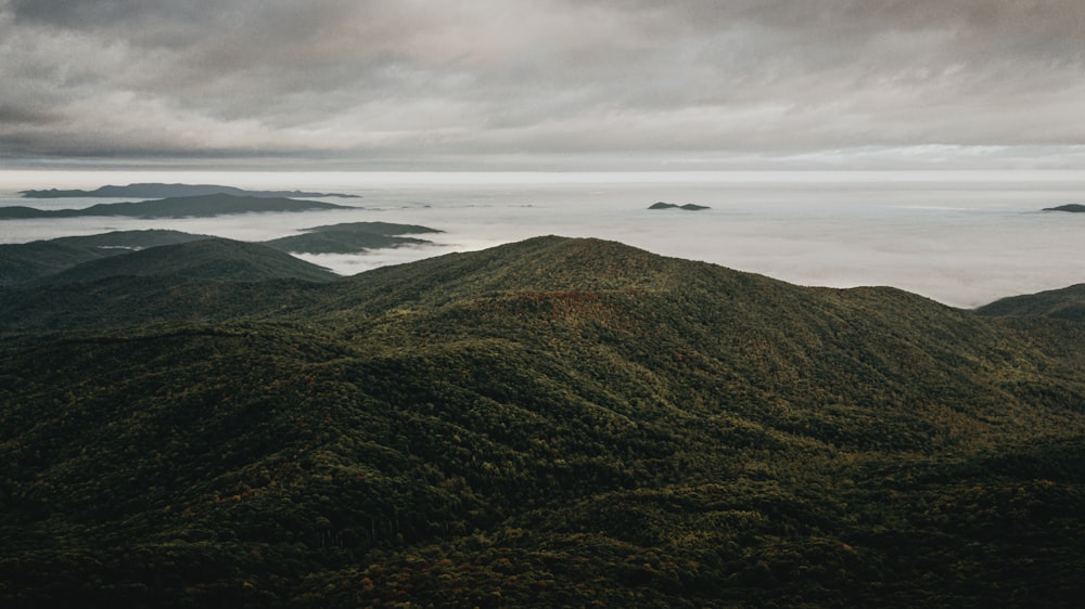 a view of a mountain range covered in clouds