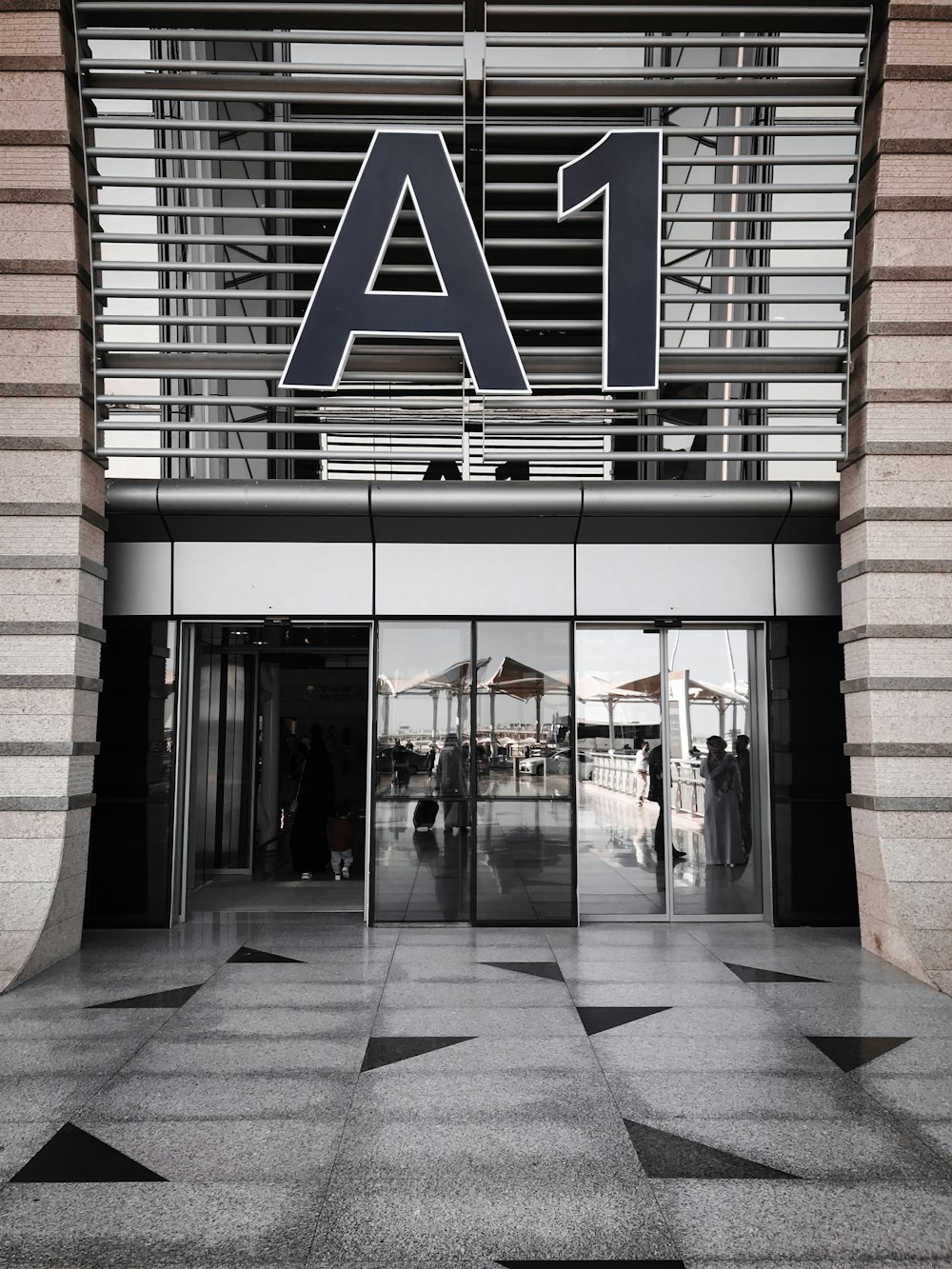 the entrance to a building with a star pattern on the floor