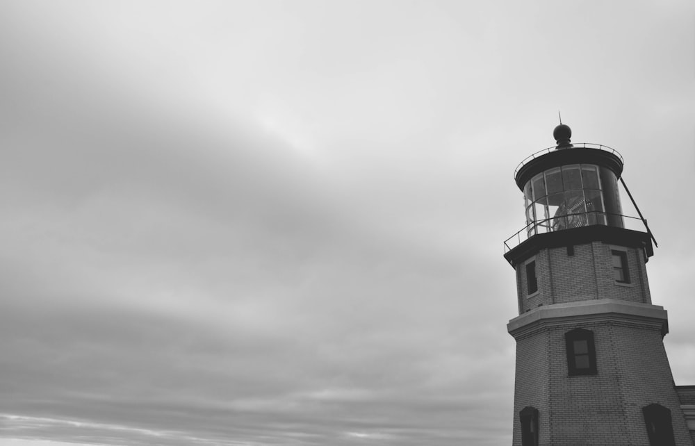 a black and white photo of a lighthouse