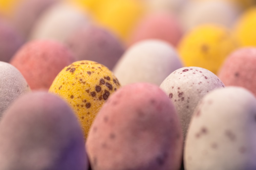 a group of different colored candies sitting next to each other