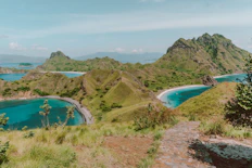 a scenic view of a lagoon and a beach