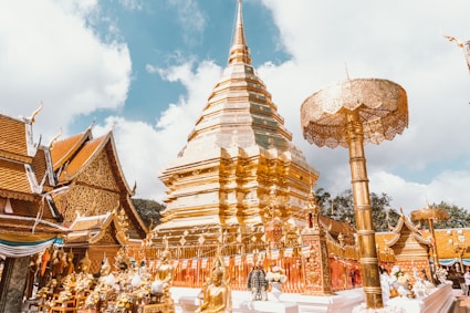 a gold and white building with a sky background