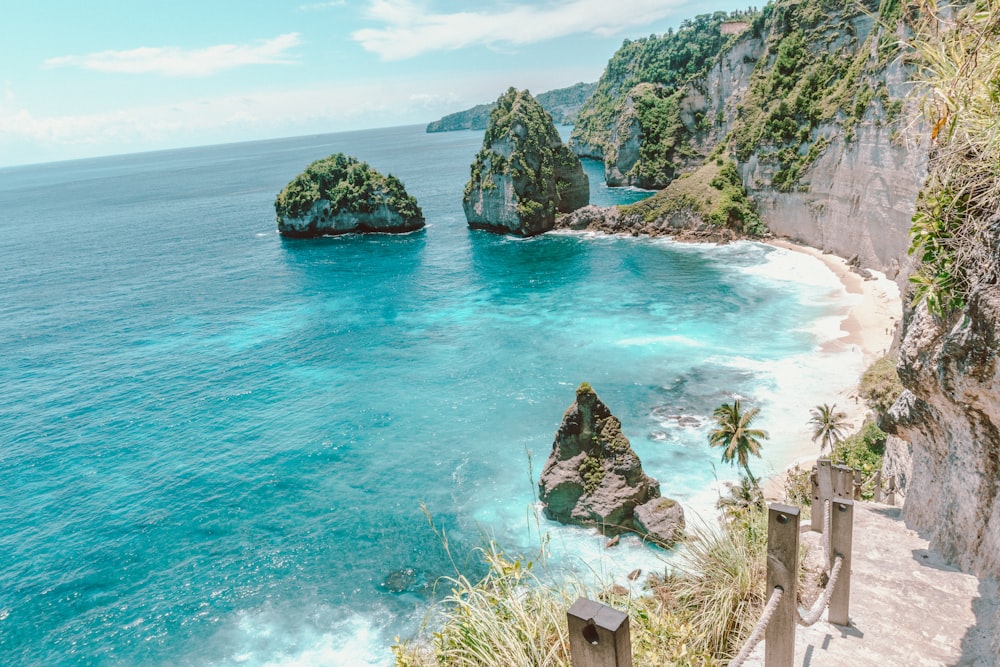 a view of the ocean from the top of a hill