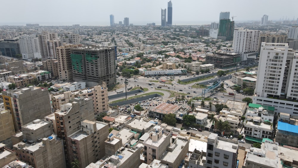 an aerial view of a city with tall buildings