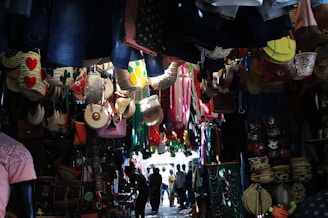 a group of people walking through a market