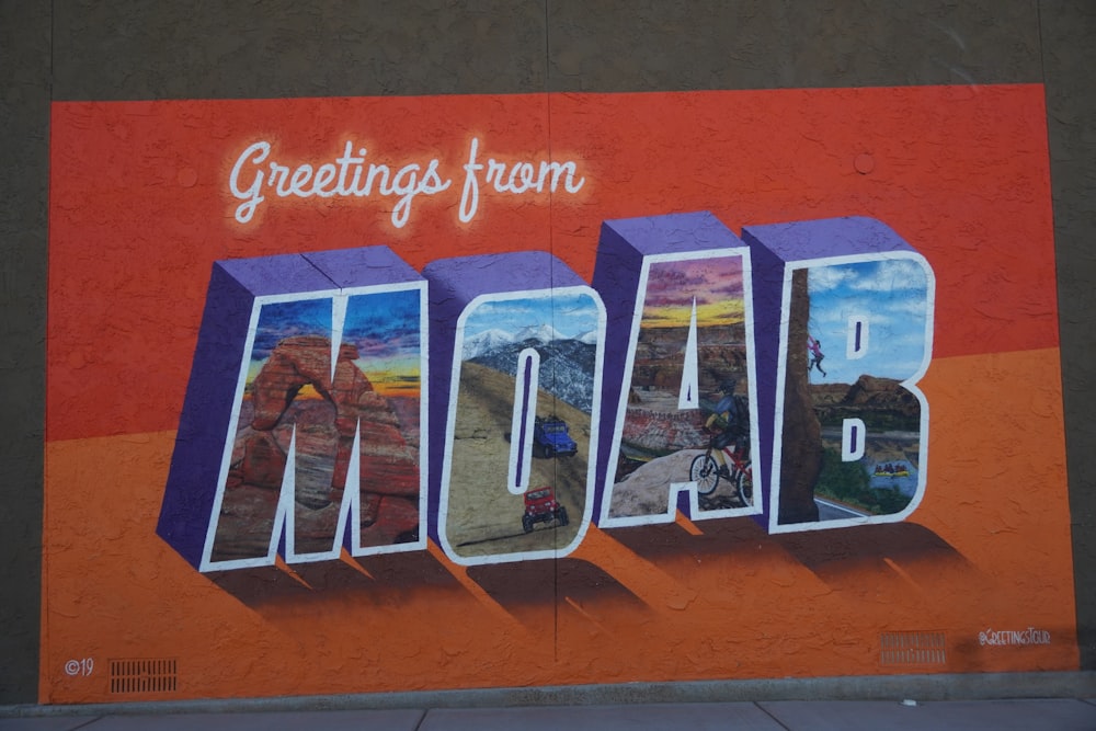 a mural of the word moab painted on the side of a building