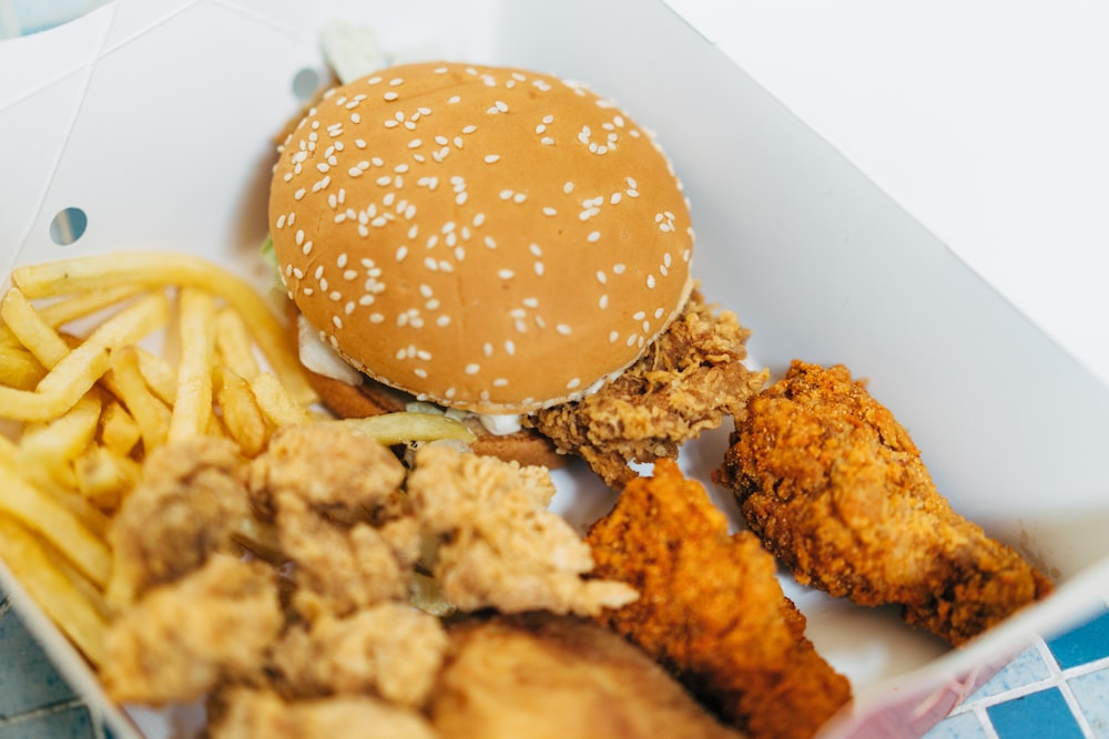 a close up of a box of food with a hamburger