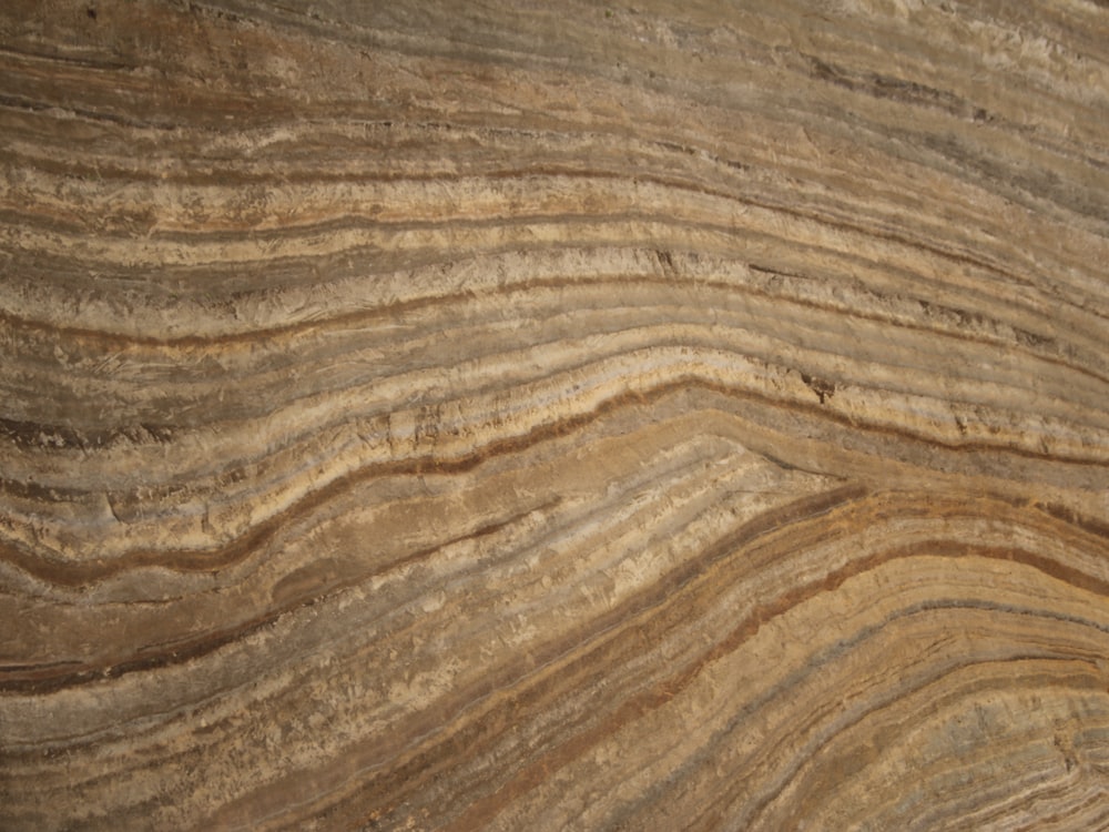 a close up of a wooden surface with wavy lines