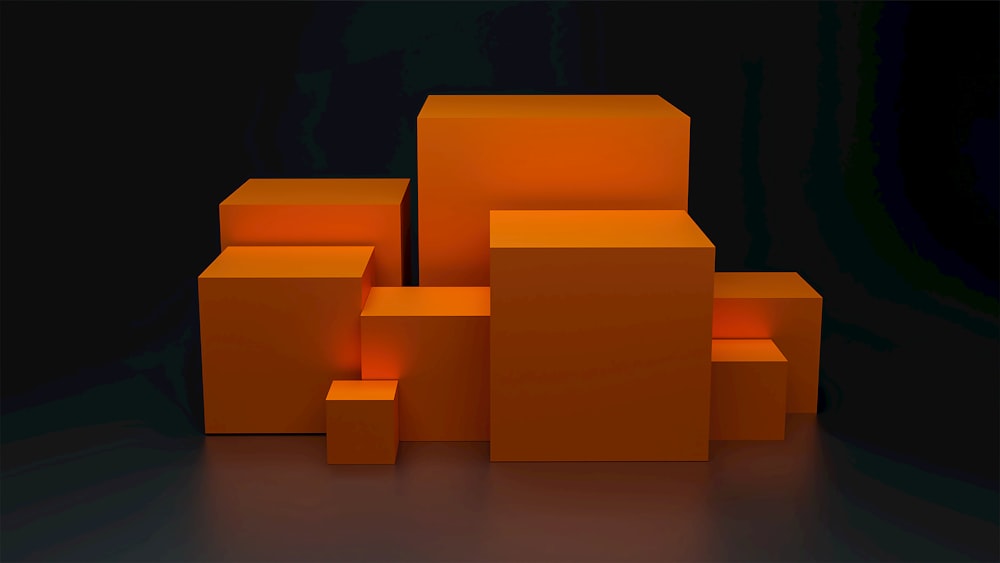 서로 위에 앉아있는 주황색 큐브 그룹