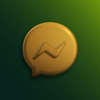 a gold speech bubble with a wave on it