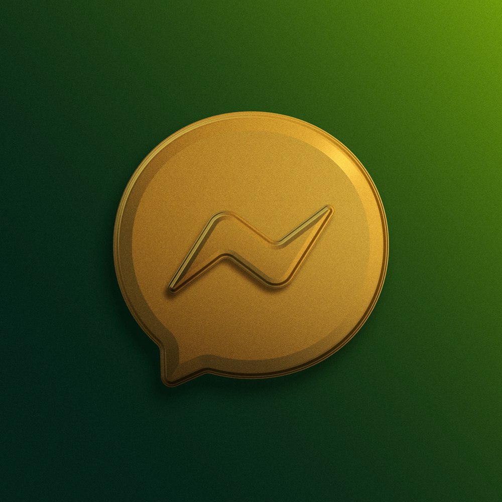 a gold speech bubble with a wave on it