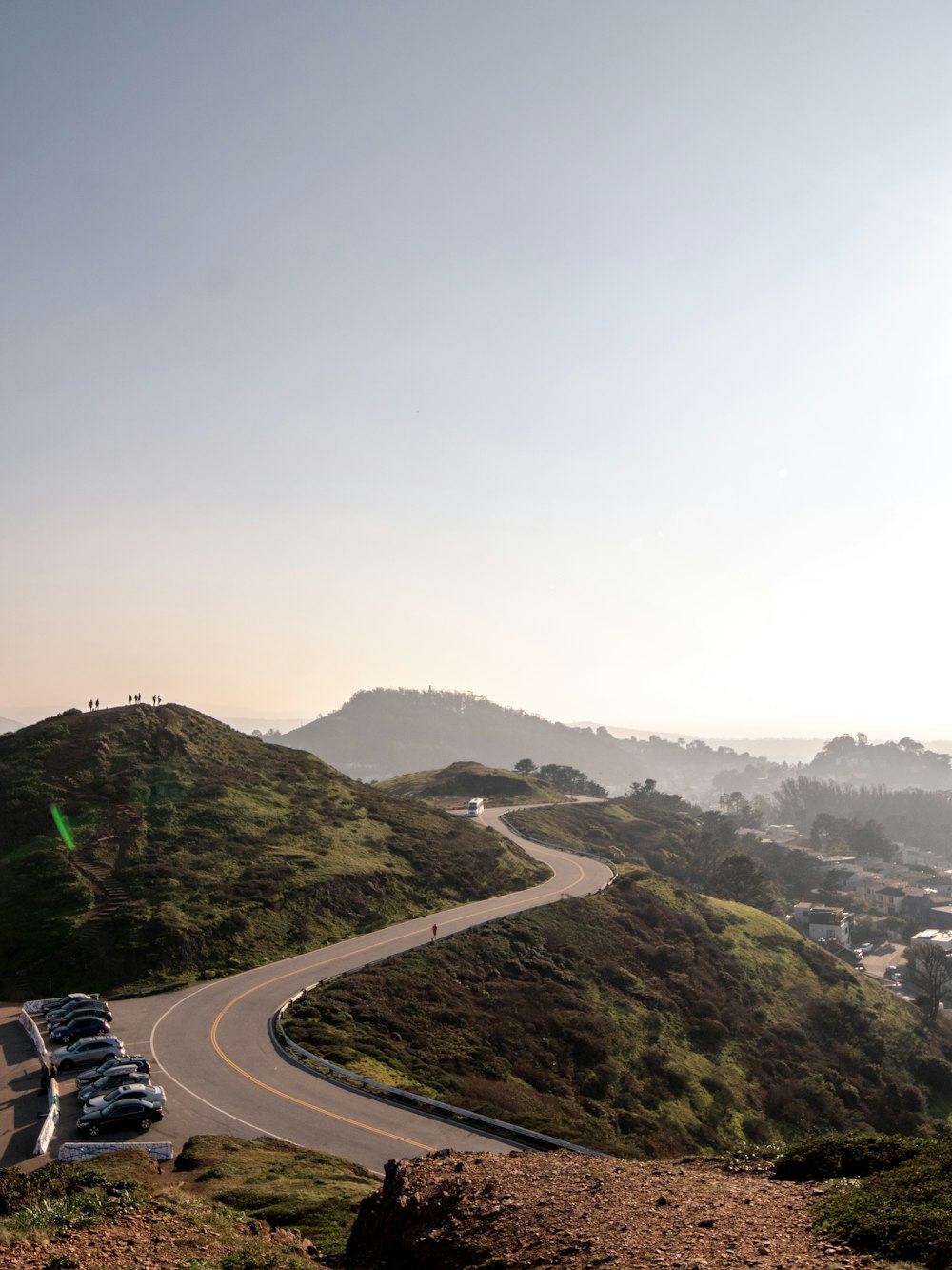 a car driving down a winding road in the mountains