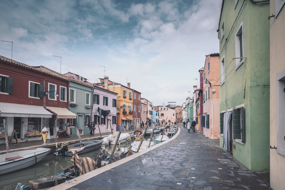 a row of buildings next to a body of water