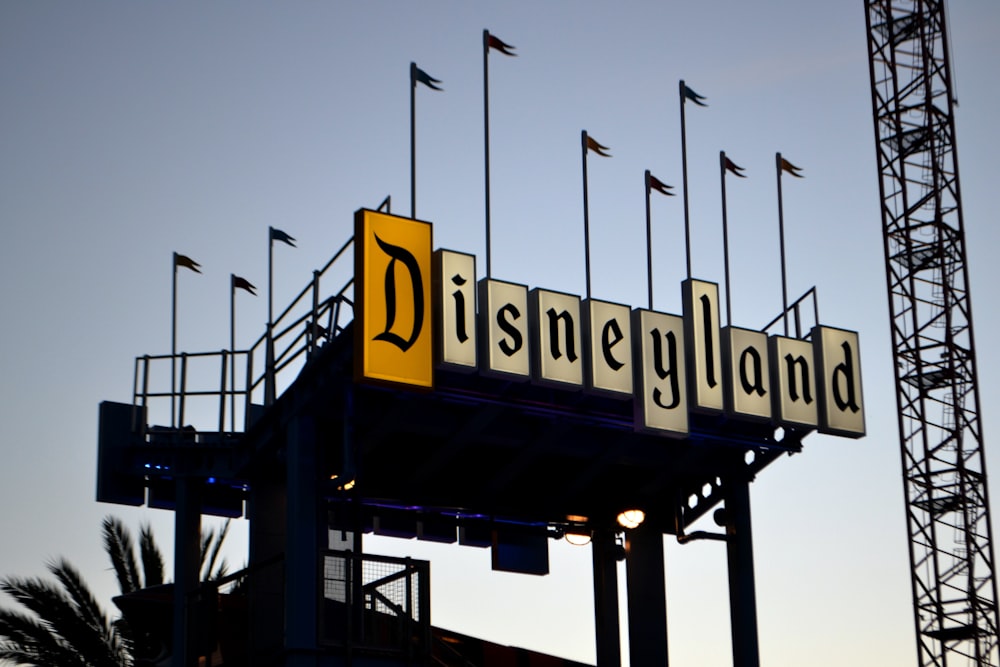 a sign for a disney land amusement park