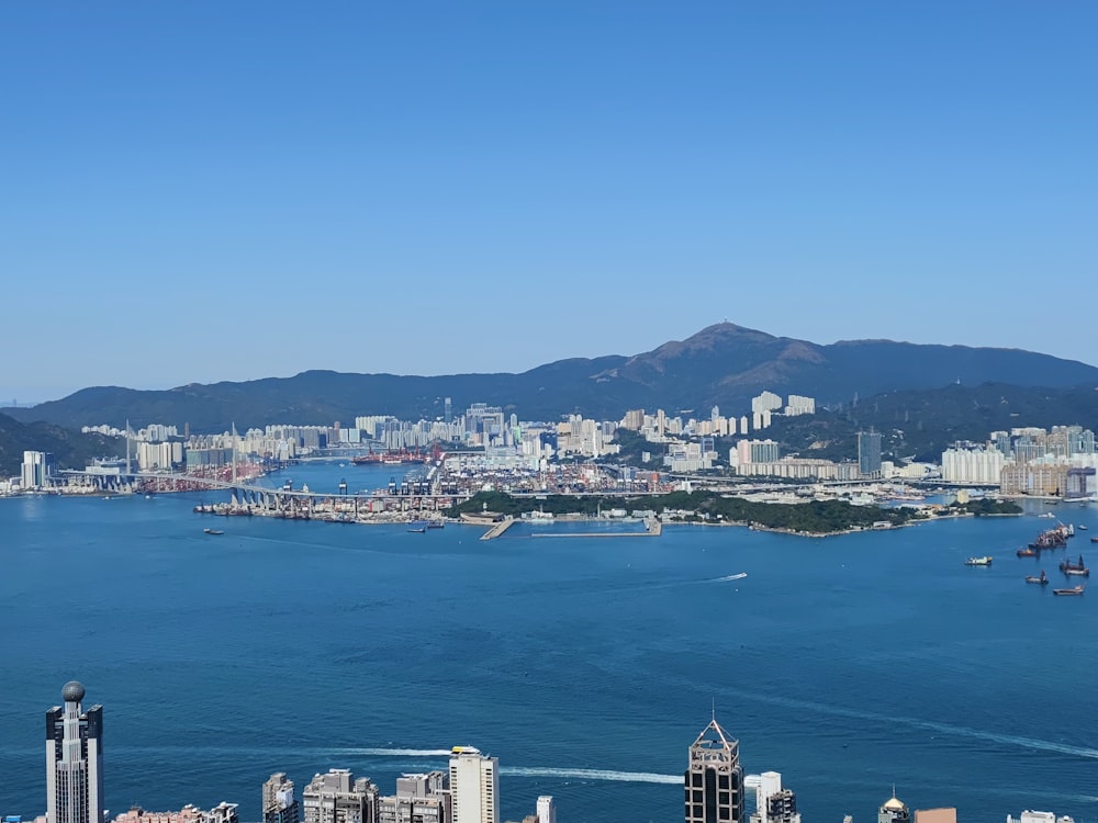 a large body of water with a city in the background