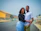 a man and a woman standing in the middle of a street