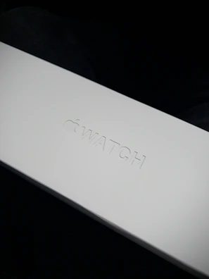 A sleek, minimalistic package box with the flowvista logo glowing softly in the background
