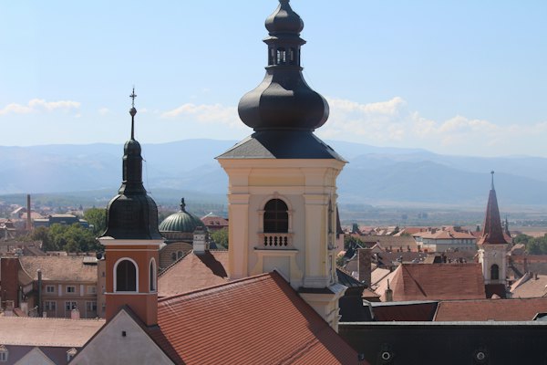 Church towers above the roofs — Sibiu, Romania