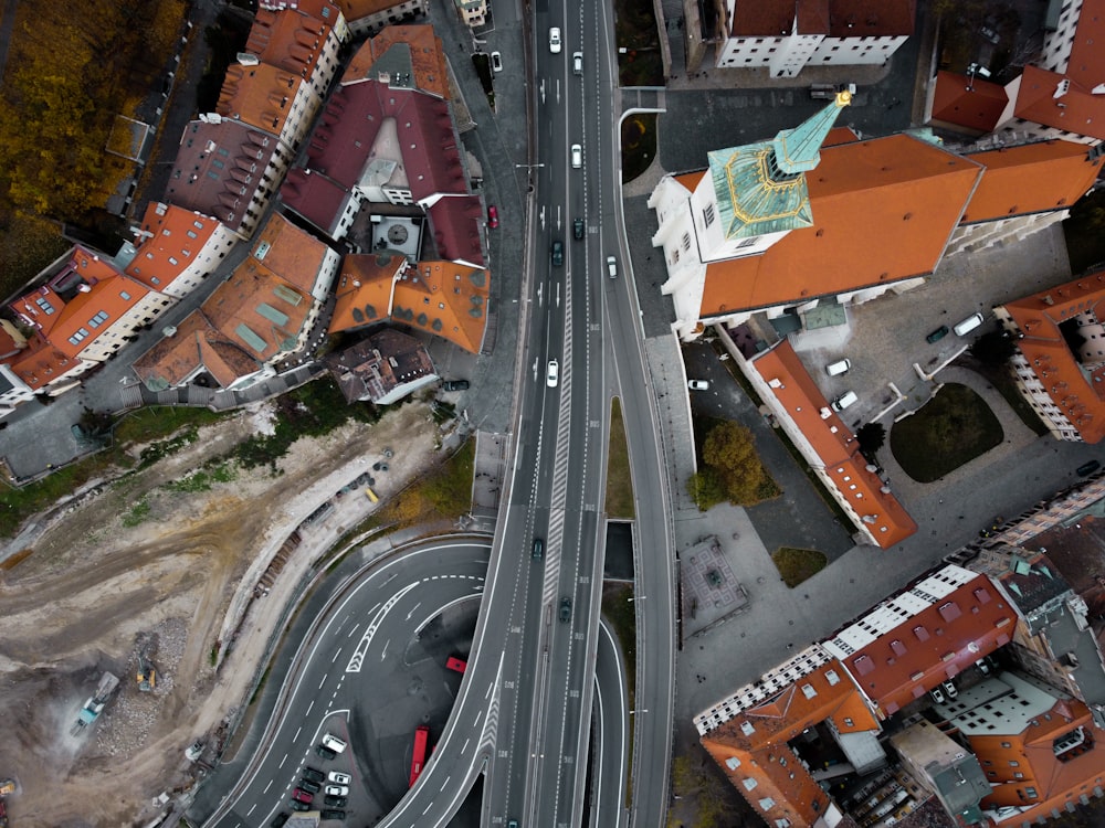an aerial view of a city with a highway