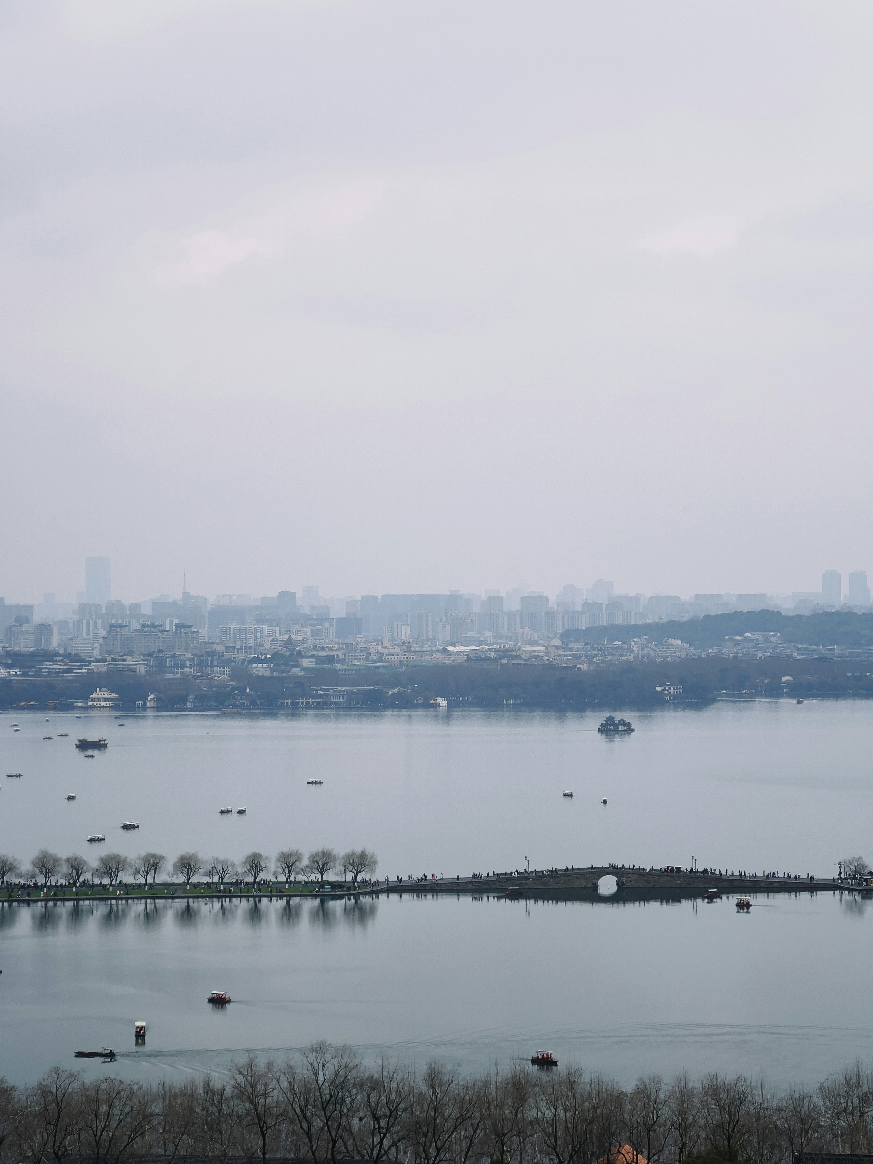 a large body of water with a city in the background