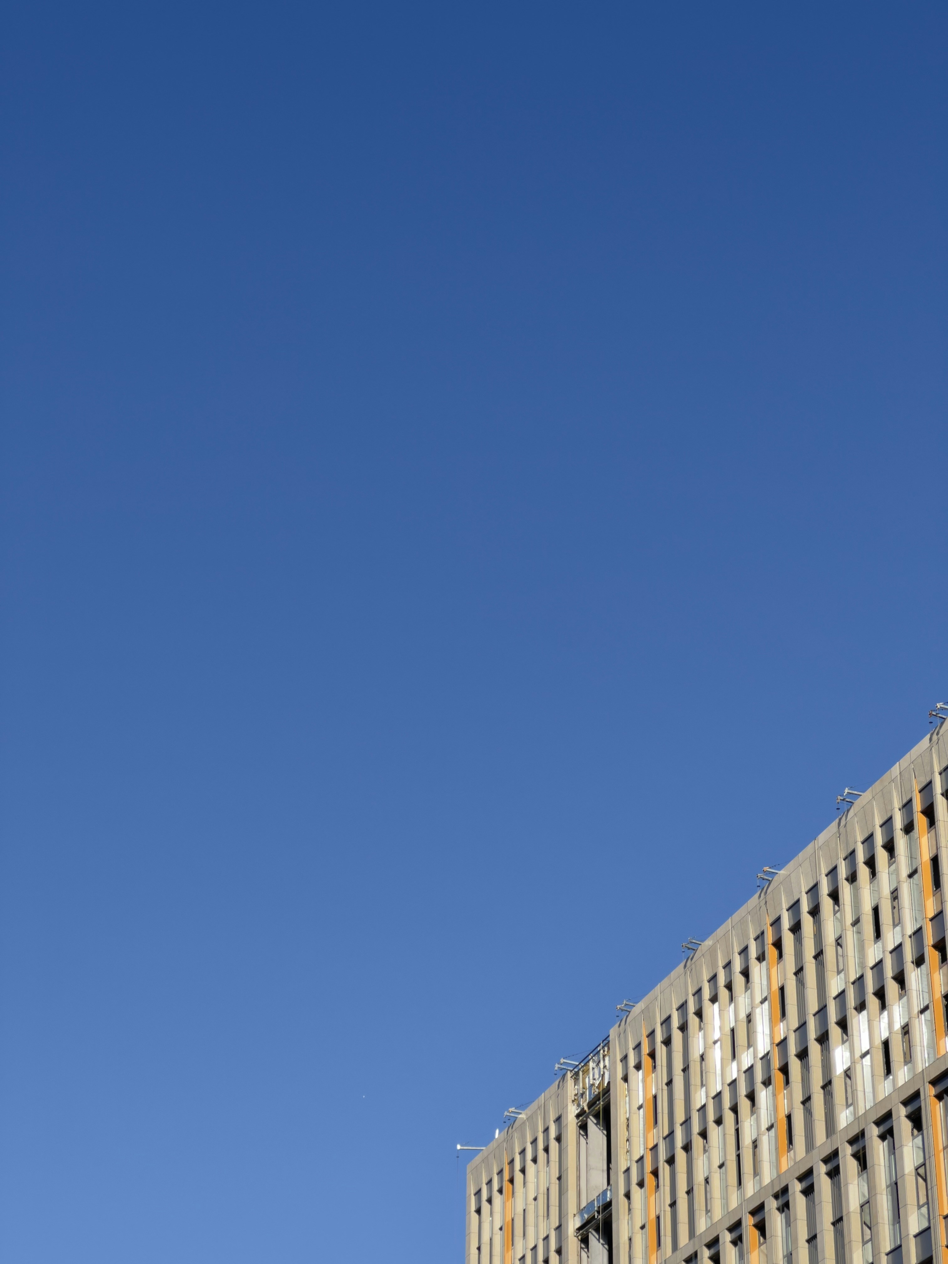 a tall building with a clock on the side of it