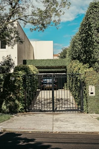 a car is parked in front of a gate