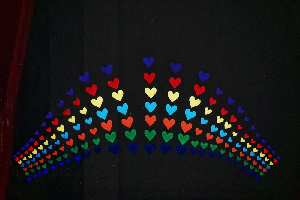 a picture of a rainbow made out of hearts