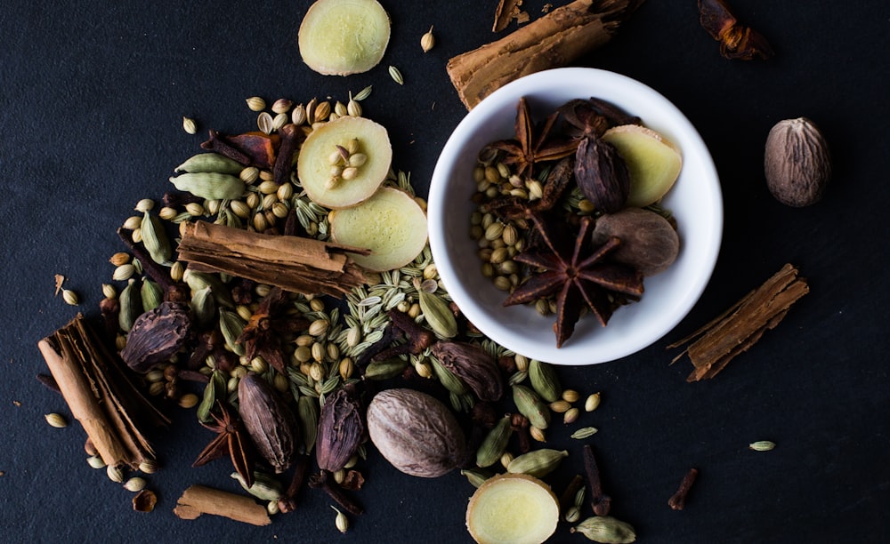 a bowl filled with nuts and spices