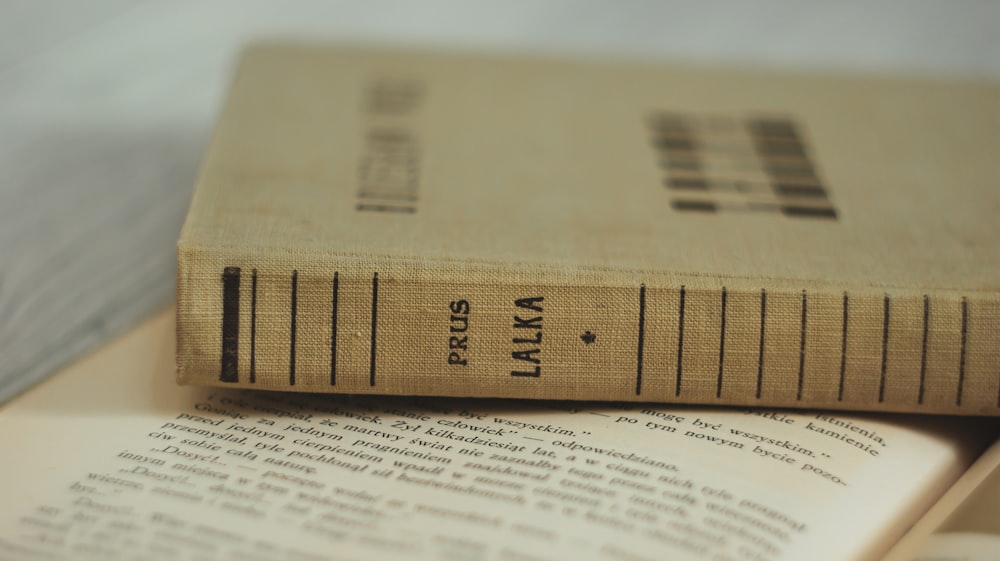 a book sitting on top of an open book