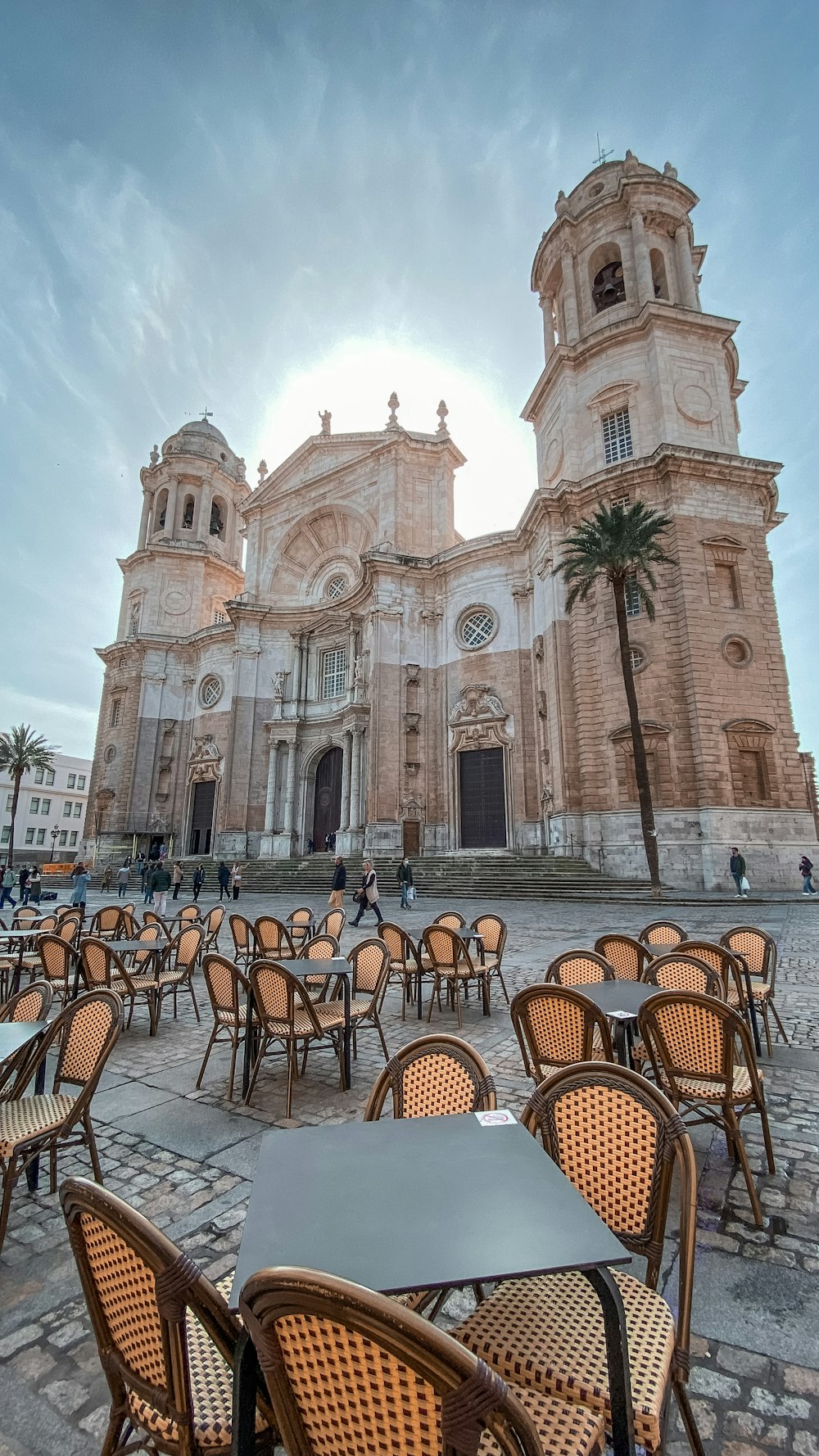 tables and chairs outside of an old church