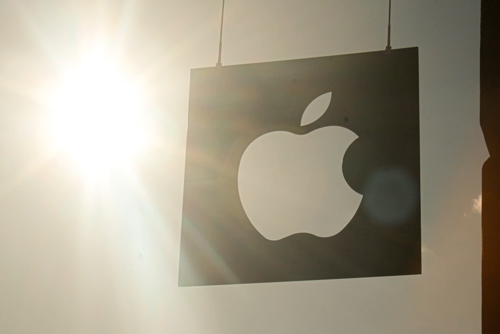 a picture of an apple logo hanging on a wall