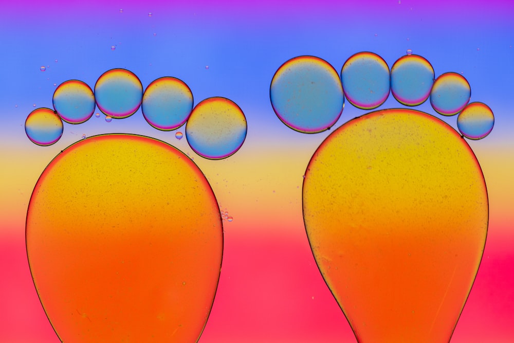 a picture of a pair of feet with bubbles on them