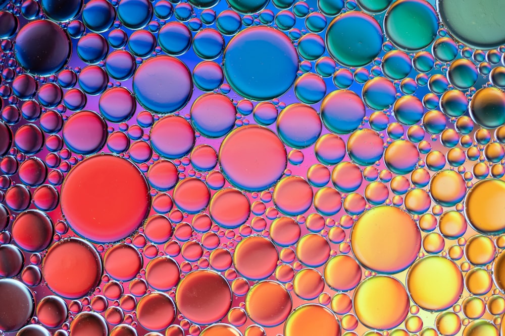 a close up view of colorful bubbles in water