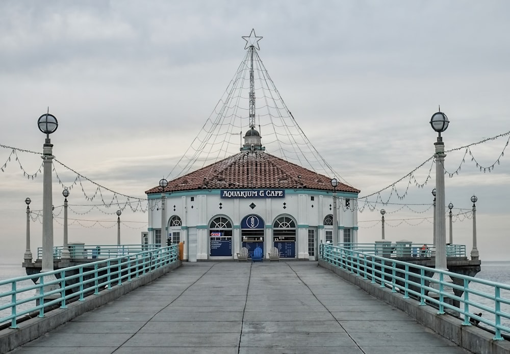 a pier with a building and lights on it