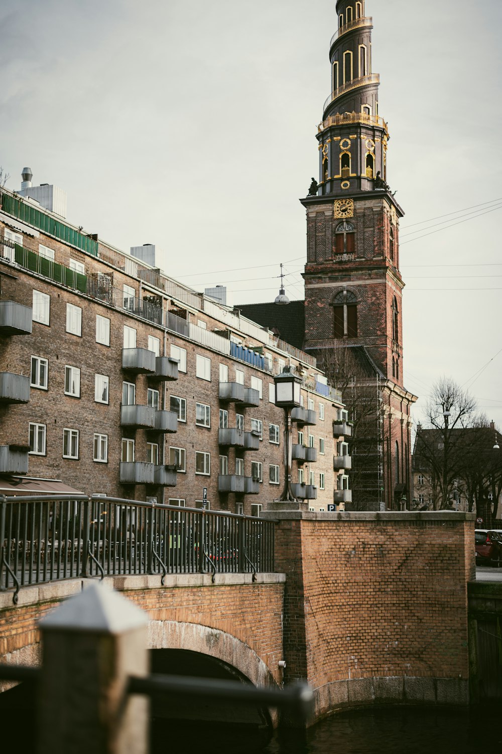 a tall clock tower towering over a city